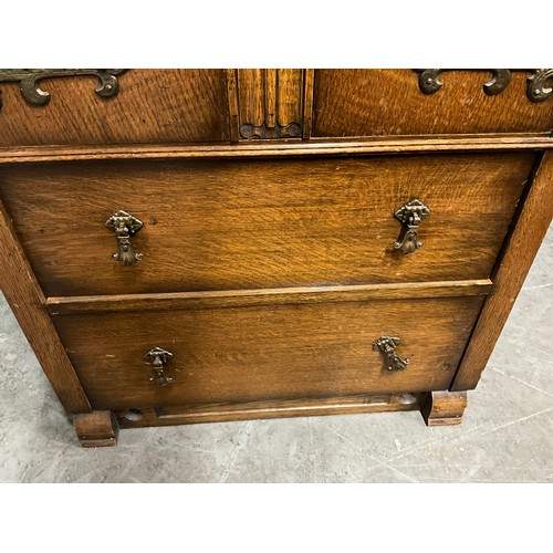 490 - VINTAGE OAK TWO DOOR OVER TWO DRAWERS TALLBOY WITH CARVED PANEL FRONT H42