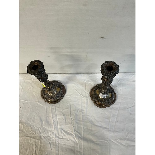 523 - PAIR OF ORNATE SILVER PLATED WEIGHTED CANDLESTICKS  H12