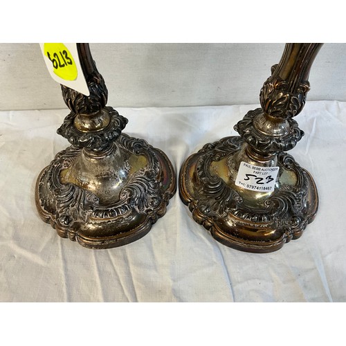 523 - PAIR OF ORNATE SILVER PLATED WEIGHTED CANDLESTICKS  H12