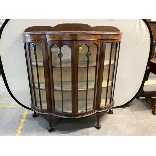 524 - OAK GLASS DOOR DISPLAY CABINET ON BALL AND CLAW FEET WITH SHAPED SHELVES TO INTERIOR H51