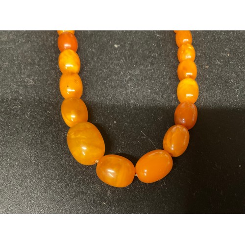 81 - TWO AMBER NECKLACES AND A PAIR OF EARINGS A/F TOTAL WEIGHT 45.2G