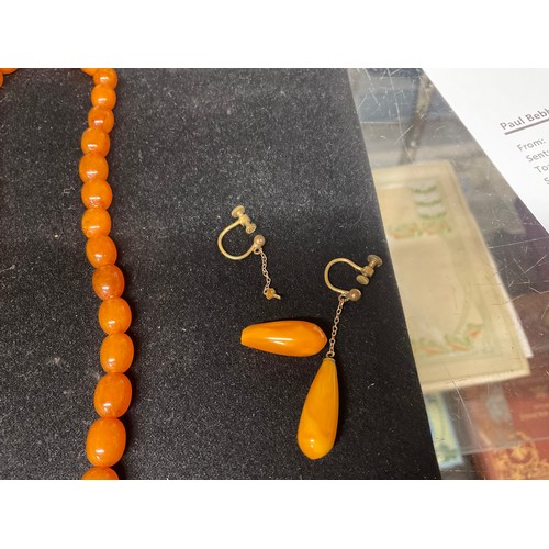 81 - TWO AMBER NECKLACES AND A PAIR OF EARINGS A/F TOTAL WEIGHT 45.2G