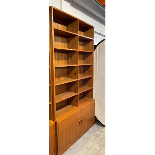 379 - ONE LARGE VINTAGE TEAK BOOK CASE AND SMALL BOOKCASE H 88’ W 52’ D 12’, H 31’ W 52’ D 8’