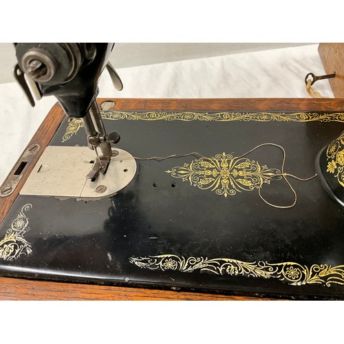 397 - ANTIQUE SINGER SEWING MACHINE IN ORIGNAL OAK CASE