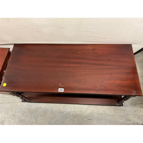 402 - MODERN MAHOGANY COFFEE TABLE AND A MODERN SET OF MAHOGANY NEST OF TABLES