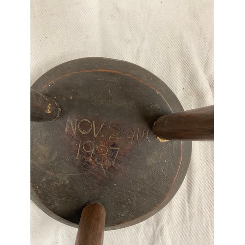 426 - TWO ANTIQUE MILKING STOOLS CIRCULAR ONE DATED 1937 SMALL H9.5