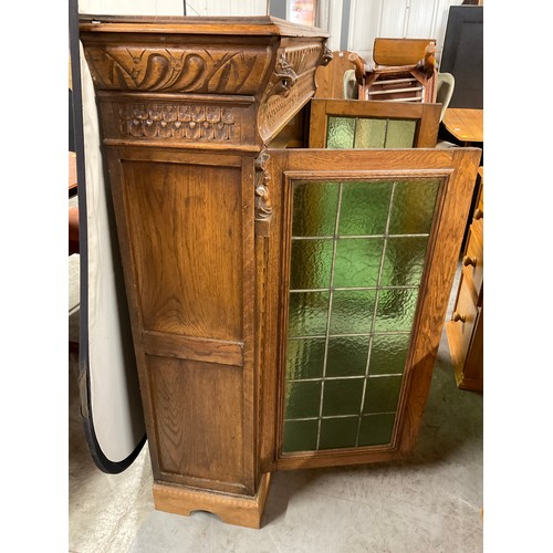 429 - EDWARDIAN CARVED OAK GOTHIC STYLE TWO DOOR BOOK CASE WITH GREEN GLASS PANELS W46