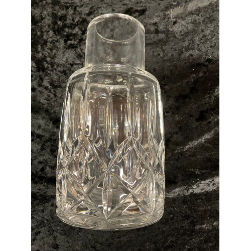 69 - CUT GLASS CARAFE ALONG WITH A WATERFORD CRYSTAL LOW BOWL