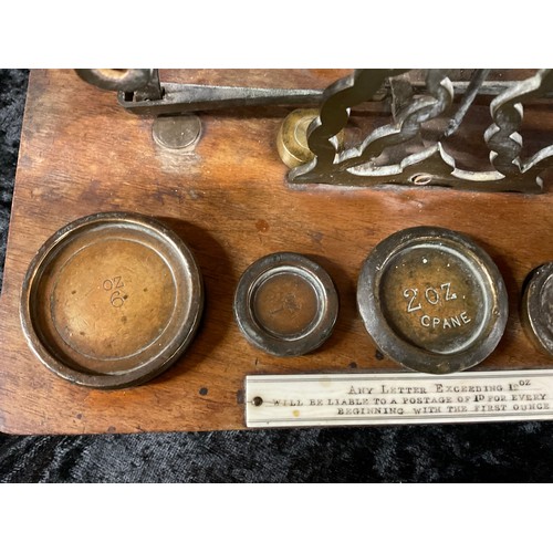 79 - SET OF ANTIQUE BRASS POSTAGE  SCALES WITH WEIGHTS MOUNTED ON WOODEN BASE