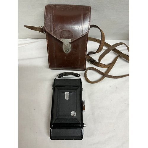 86 - TWO ANTIQUE FOLDING CAMERAS, LIGHT METER AND A UNIVERSAL AVOMINOR ALL IN LEATHER CASES