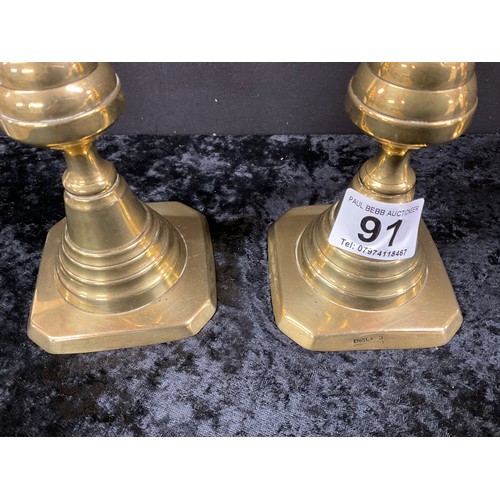 91 - TWO PAIRS OF ANTIQUE BRASS CANDLESTICKS WITH PUSHERS