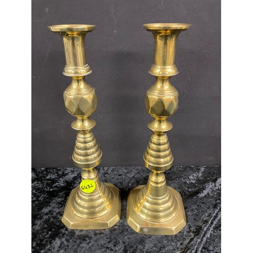 91 - TWO PAIRS OF ANTIQUE BRASS CANDLESTICKS WITH PUSHERS