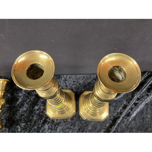 91 - TWO PAIRS OF ANTIQUE BRASS CANDLESTICKS WITH PUSHERS