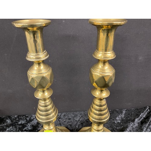 91 - TWO PAIRS OF ANTIQUE BRASS CANDLESTICKS WITH PUSHERS