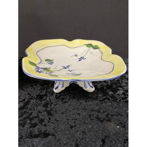 179 - YELLOW CERAMIC GLAZED FLOWER VASE AND A HAND PAINTED CERAMIC DISH MOUNTED ON FOUR FEET