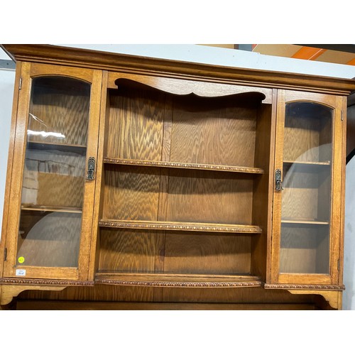 358 - LARGE EDWARDIAN DRESSER WITH OPEN CENTER RACK FLANKED BY 2 GLAED DOORS OVER 3 CENTRAL DRAWERS FLANKE... 