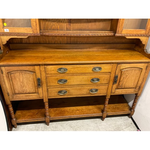 358 - LARGE EDWARDIAN DRESSER WITH OPEN CENTER RACK FLANKED BY 2 GLAED DOORS OVER 3 CENTRAL DRAWERS FLANKE... 