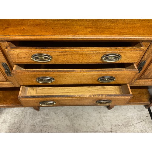 358 - LARGE EDWARDIAN DRESSER WITH OPEN CENTER RACK FLANKED BY 2 GLAED DOORS OVER 3 CENTRAL DRAWERS FLANKE... 