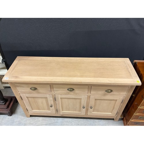 409 - MODERN LIGHT OAK SIDEBAORD THREE DRAWERS ABOVE THREE DOORS W54