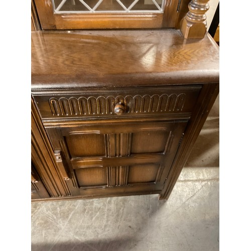 432 - OAK PRIORY STYLE COURT CUPBOARD TWO DRAWERS ABOVE TWO DOORS AND 2 GLASS DOORS TO TOP  W47