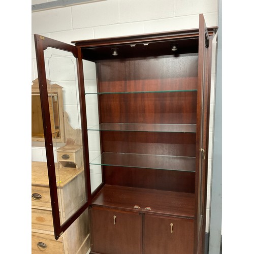 381 - MODERN STAG MAHOGANY GLAZED BOOK CASE WITH TWO CUPBOARDS TO BASE W38