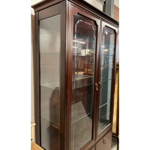 381 - MODERN STAG MAHOGANY GLAZED BOOK CASE WITH TWO CUPBOARDS TO BASE W38