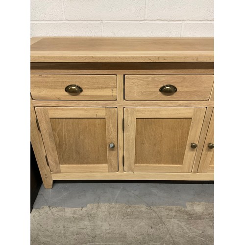 387 - MODERN OAK SIDEBAORD WITH FOUR DRAWERS OVER FOUR CUPBOARD W74