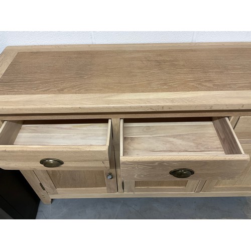 387 - MODERN OAK SIDEBAORD WITH FOUR DRAWERS OVER FOUR CUPBOARD W74