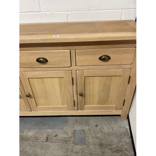 387 - MODERN OAK SIDEBAORD WITH FOUR DRAWERS OVER FOUR CUPBOARD W74