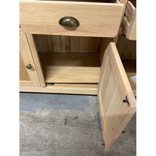 387 - MODERN OAK SIDEBAORD WITH FOUR DRAWERS OVER FOUR CUPBOARD W74