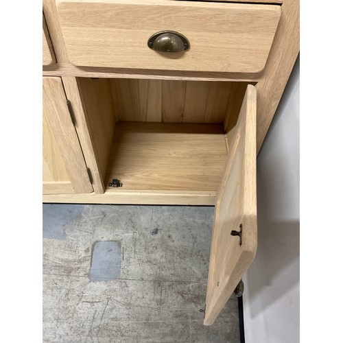 387 - MODERN OAK SIDEBAORD WITH FOUR DRAWERS OVER FOUR CUPBOARD W74