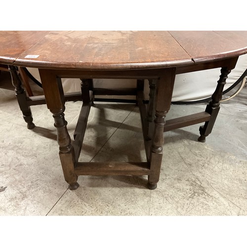 446 - ANTIQUE OAK DROP LEAF GATE LEG TABLE ON TURNED SUPPORTS PEGGED AND DOWELED  W46