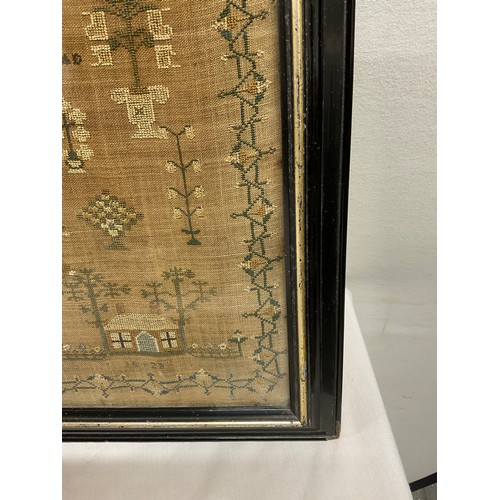 61 - FRAMED ANTIQUE SAMPLER DEPICITNG VARIOUS BUILDINGS, BIRDS ETC SIGNED MARIA DEAN AGED 14   19.5