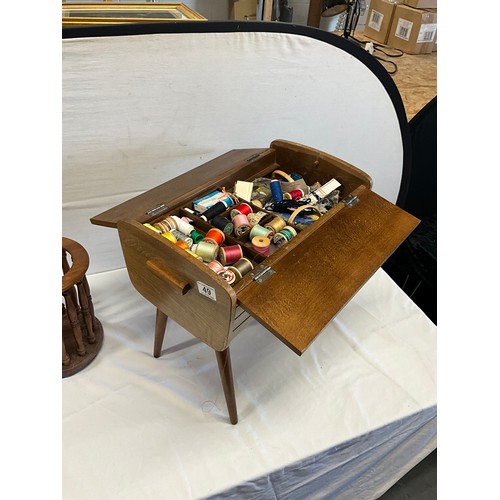 49 - VINTAGE WOODEN SEWING BOX WITH ASSORTMENT OF THREADS ETC ON FOUR TURNED LEGS H18