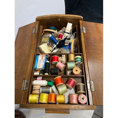 49 - VINTAGE WOODEN SEWING BOX WITH ASSORTMENT OF THREADS ETC ON FOUR TURNED LEGS H18