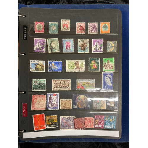 110 - TWO ALBUMS OF USED POSTAGE STAMPS AROUND THE WORLD