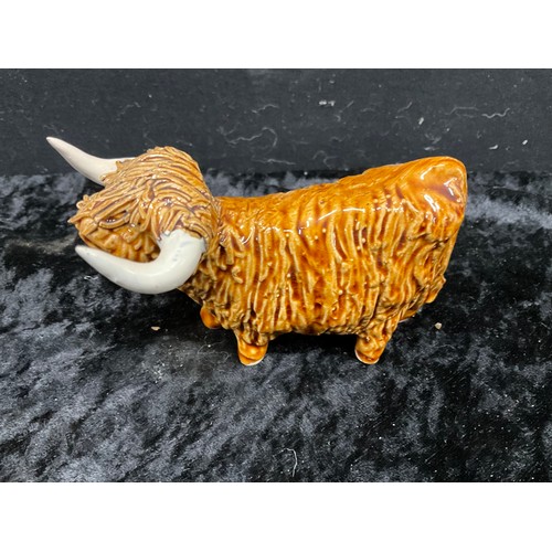 133 - COLLECTION OF CERAMIC ANIMALS TO INCLUDE THREE HIGHLAND CATTLE SIGNED TO BASE AND TWO CERAMIC SHEEP