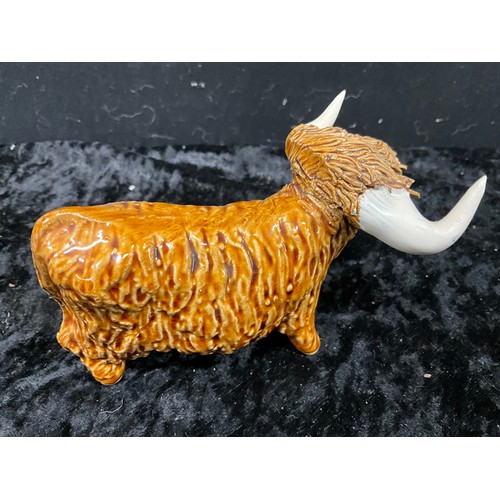 133 - COLLECTION OF CERAMIC ANIMALS TO INCLUDE THREE HIGHLAND CATTLE SIGNED TO BASE AND TWO CERAMIC SHEEP