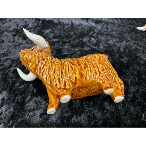 133 - COLLECTION OF CERAMIC ANIMALS TO INCLUDE THREE HIGHLAND CATTLE SIGNED TO BASE AND TWO CERAMIC SHEEP