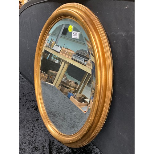 207 - LARGE OVAL BEVELLED EDGE MIRROR IN GILT WOODEN FRAME 28