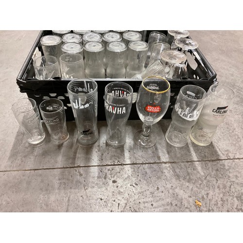 246 - THREE CRATES OF GLASSWARE TO INCLUDE CARLING STELLA ARTOIS CARLSBERG DRINKING GLASSES ETC