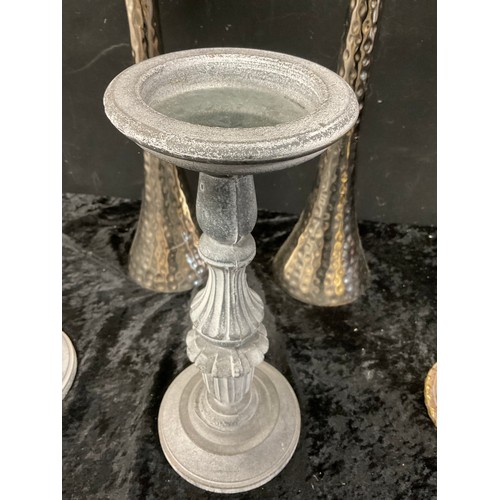 272 - TWO MODERN WHITE METAL CANDLE STANDS ALONG WITH THREE OTHER CANDLE STANDS