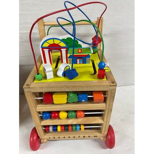 279 - ONE VINTAGE WOODEN WALKER AND ONE OTHER MODERN PLASTIC ACTIVITY CUBE