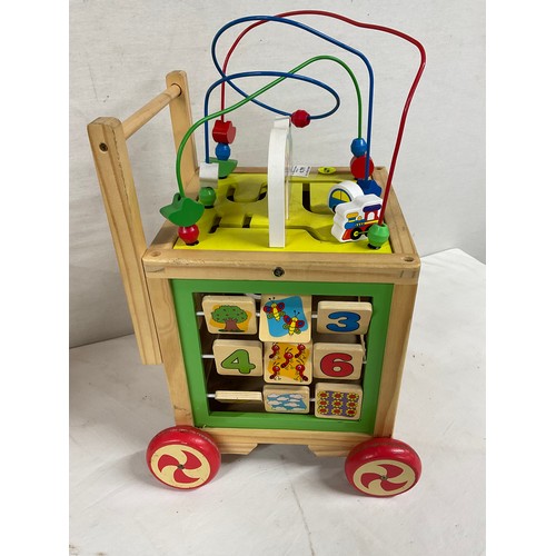 279 - ONE VINTAGE WOODEN WALKER AND ONE OTHER MODERN PLASTIC ACTIVITY CUBE