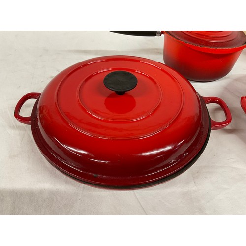 288 - BOX OF CAST IRON COOKWARE TO INCLUDE RED CASSEROLE DISH LE CREUSET SAUCEPAN WITH LID AND TWO OTHER L... 