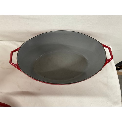 288 - BOX OF CAST IRON COOKWARE TO INCLUDE RED CASSEROLE DISH LE CREUSET SAUCEPAN WITH LID AND TWO OTHER L... 