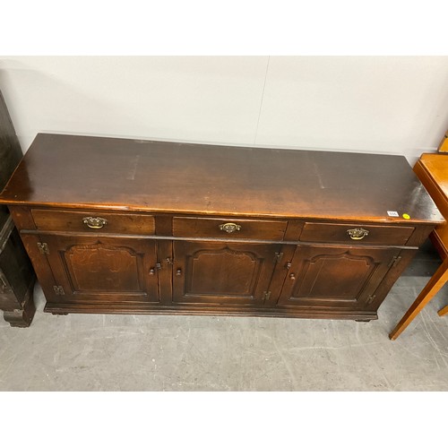 506 - LARGE REPRODUCTION OAK DRESSER BASE WITH THREE PANEL DOORS UNDER THREE DRAWERS W66