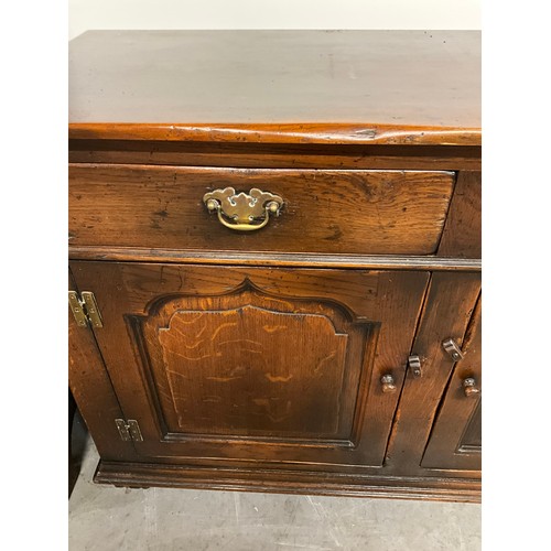 506 - LARGE REPRODUCTION OAK DRESSER BASE WITH THREE PANEL DOORS UNDER THREE DRAWERS W66