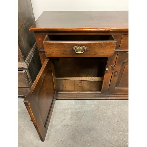 506 - LARGE REPRODUCTION OAK DRESSER BASE WITH THREE PANEL DOORS UNDER THREE DRAWERS W66