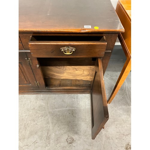 506 - LARGE REPRODUCTION OAK DRESSER BASE WITH THREE PANEL DOORS UNDER THREE DRAWERS W66